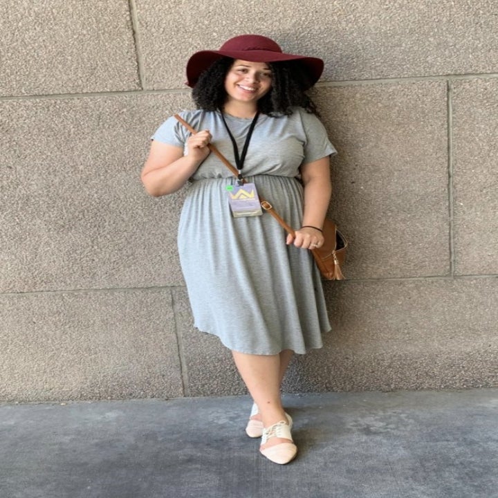 a reviewer wearing the dress in gray 