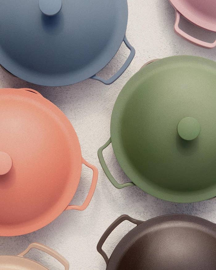 The tops of various colorful pans 
