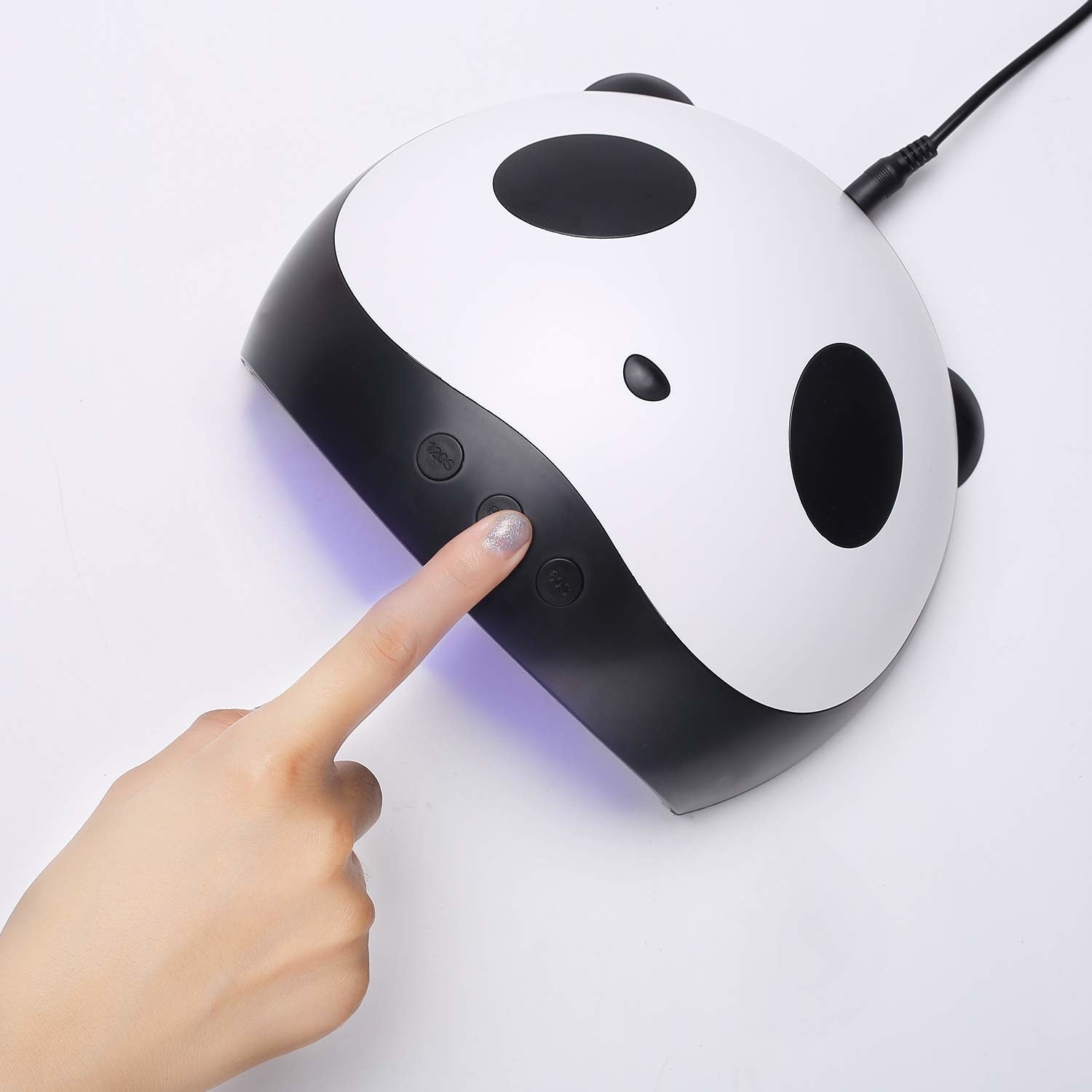 model pushes button on panda led light