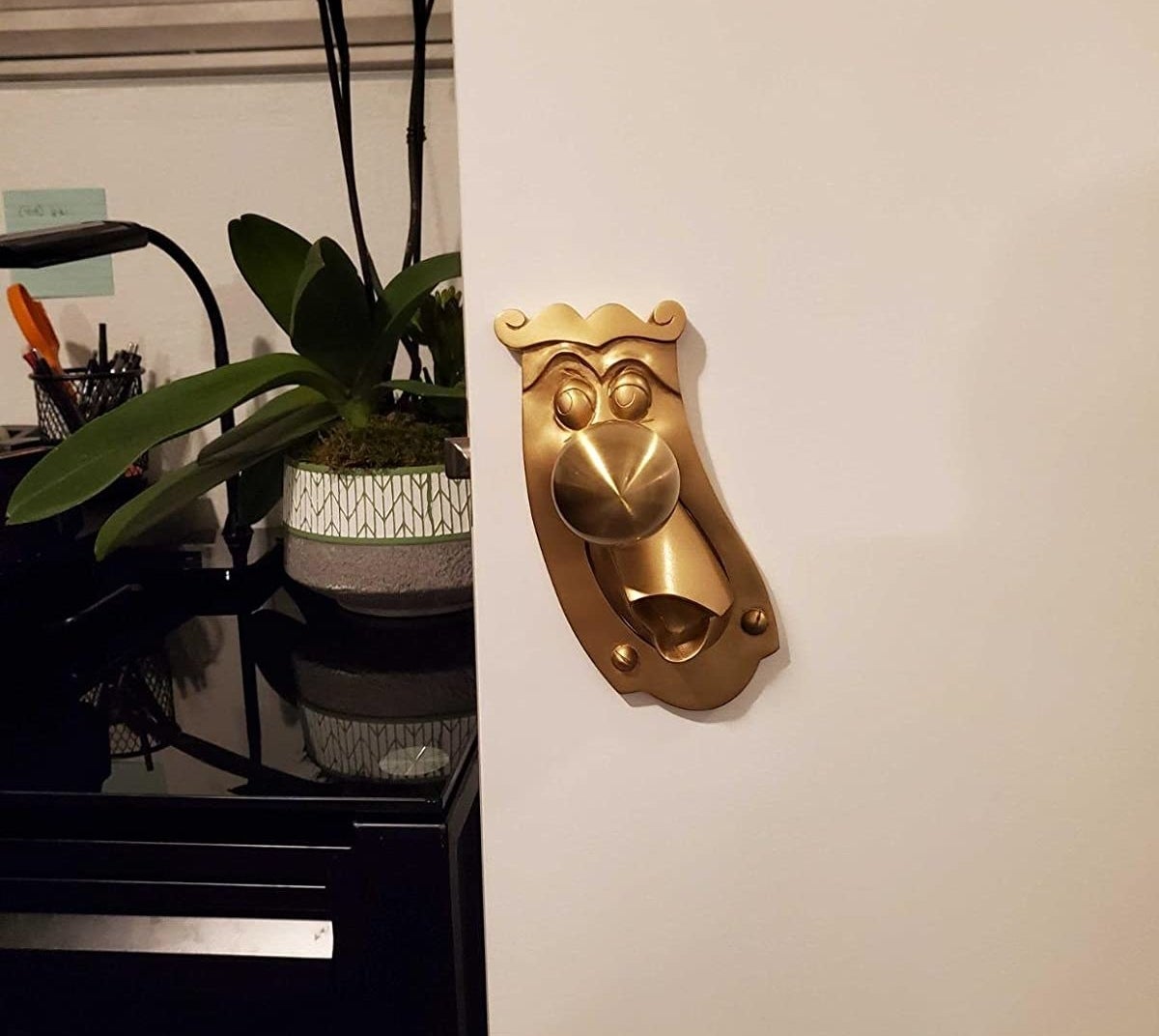 doorknob shaped like the talking one in alice in wonderland 