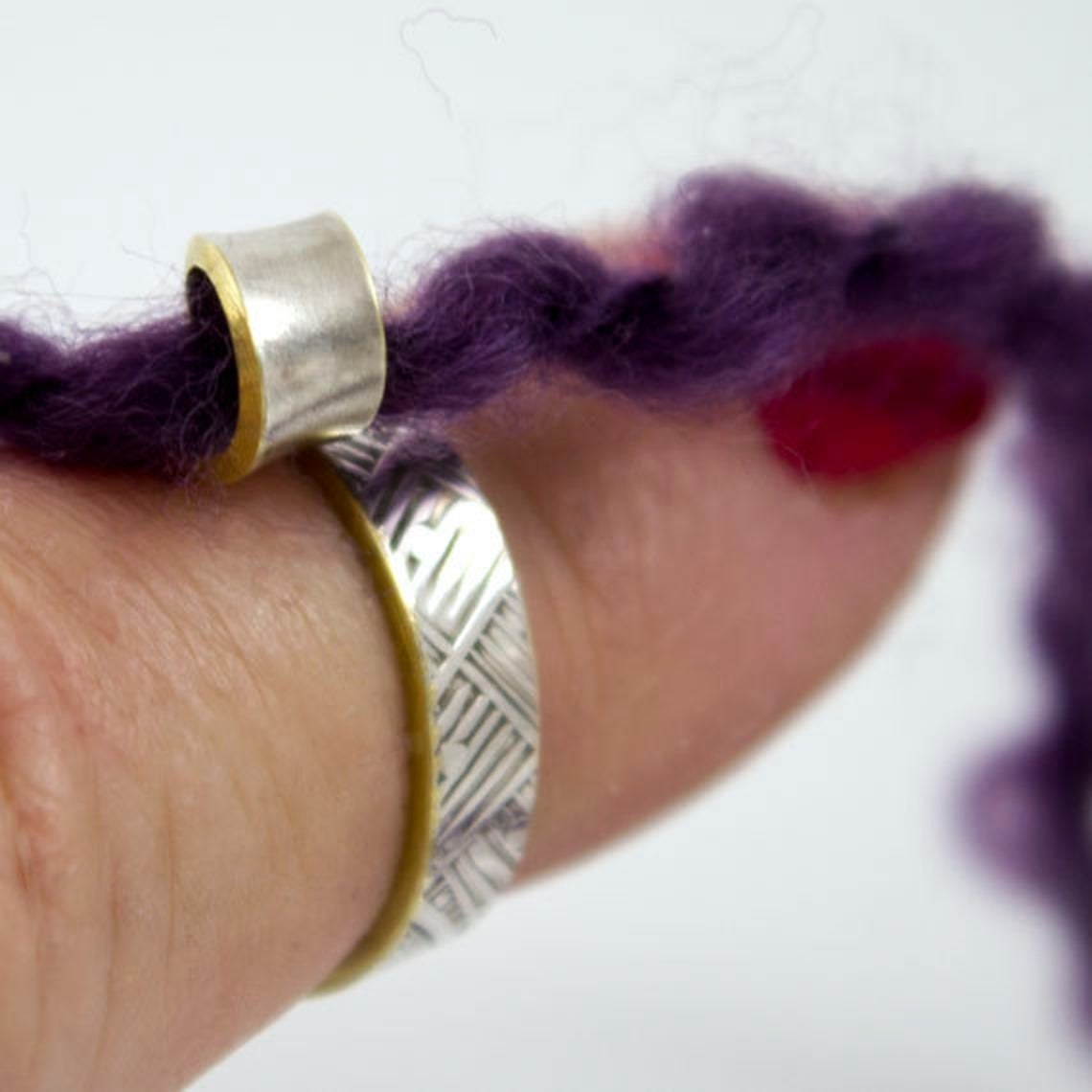ring with a loop that yarn goes through 
