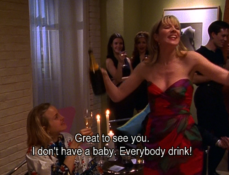 Samantha from "Sex and the City" pouring champagne at a party, saying: "Great to see you. I don't have a baby. Everybody drink!"