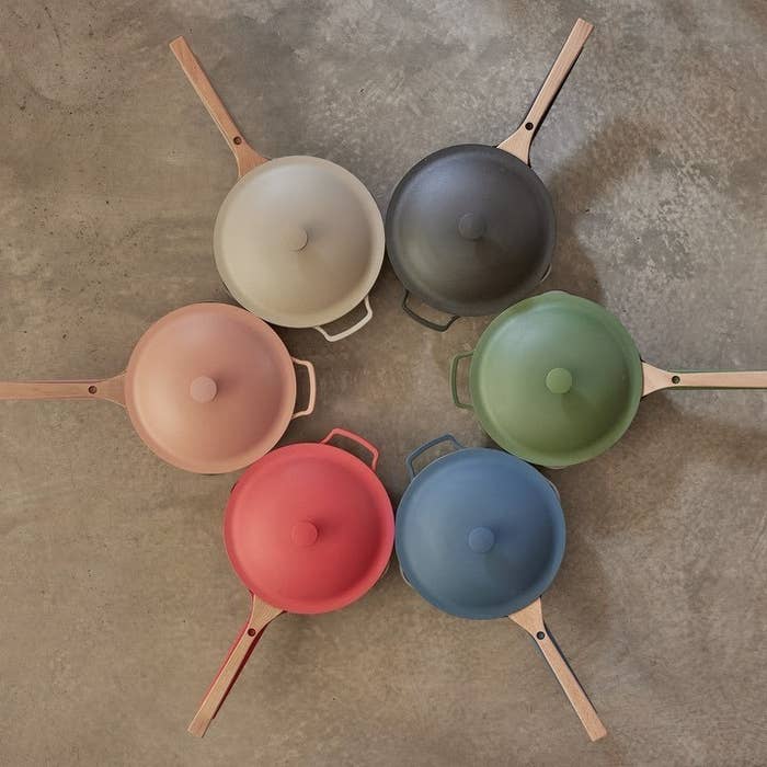 Six Always Pans in different colors arranged in a circle