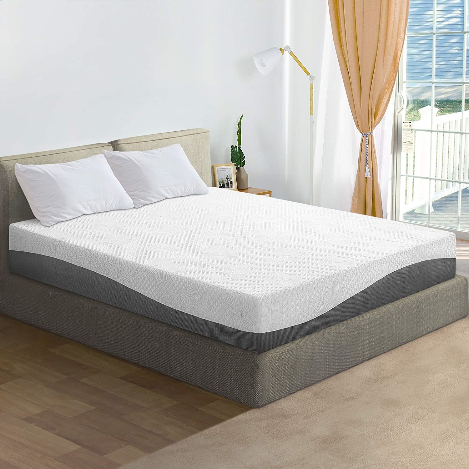 white and gray mattress on a bed