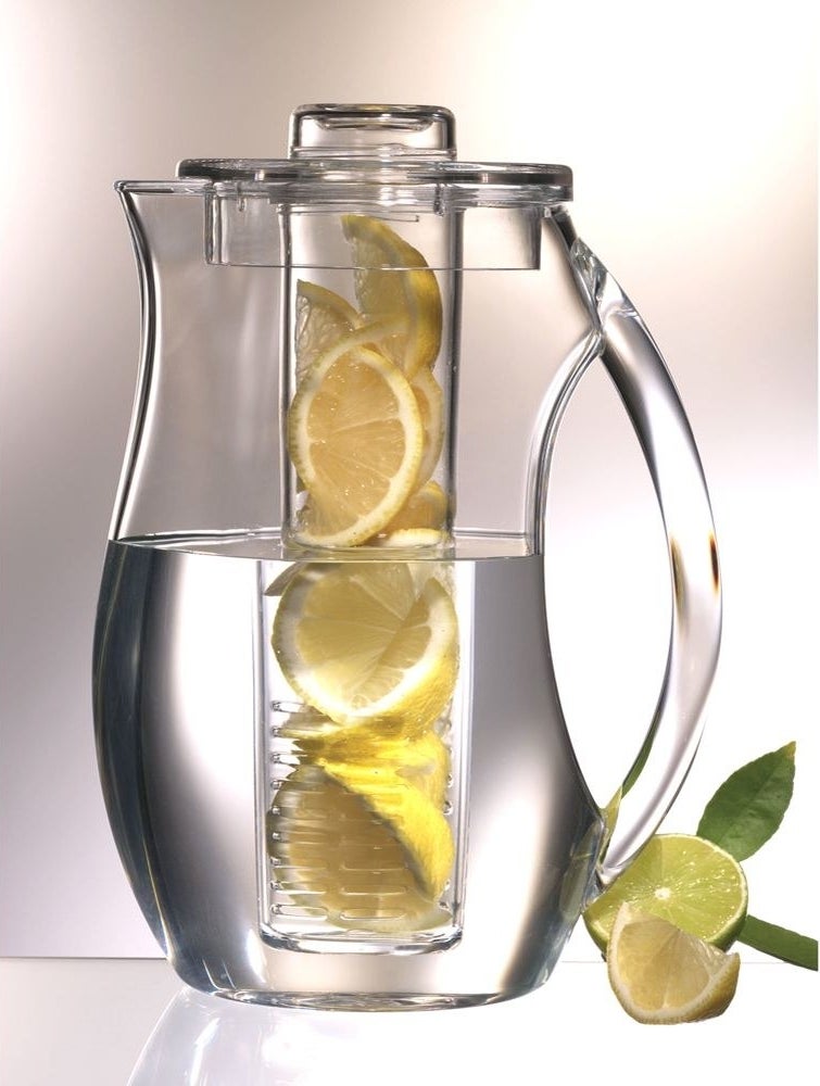 A water pitcher with lemons in it