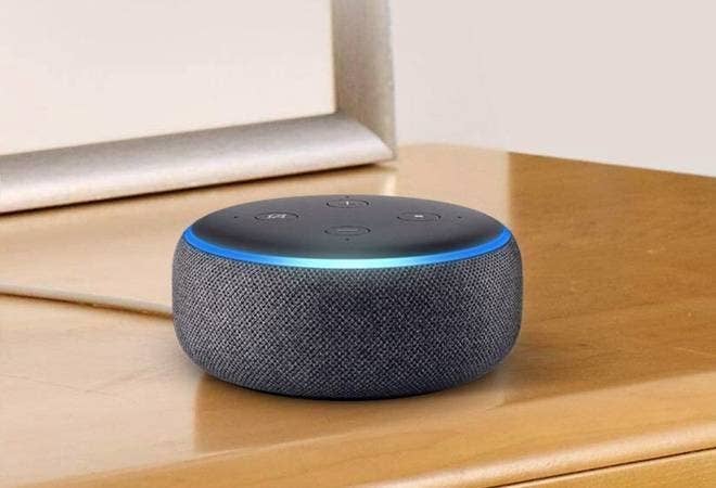 An Amazon Echo Dot 3rd Generation on a table