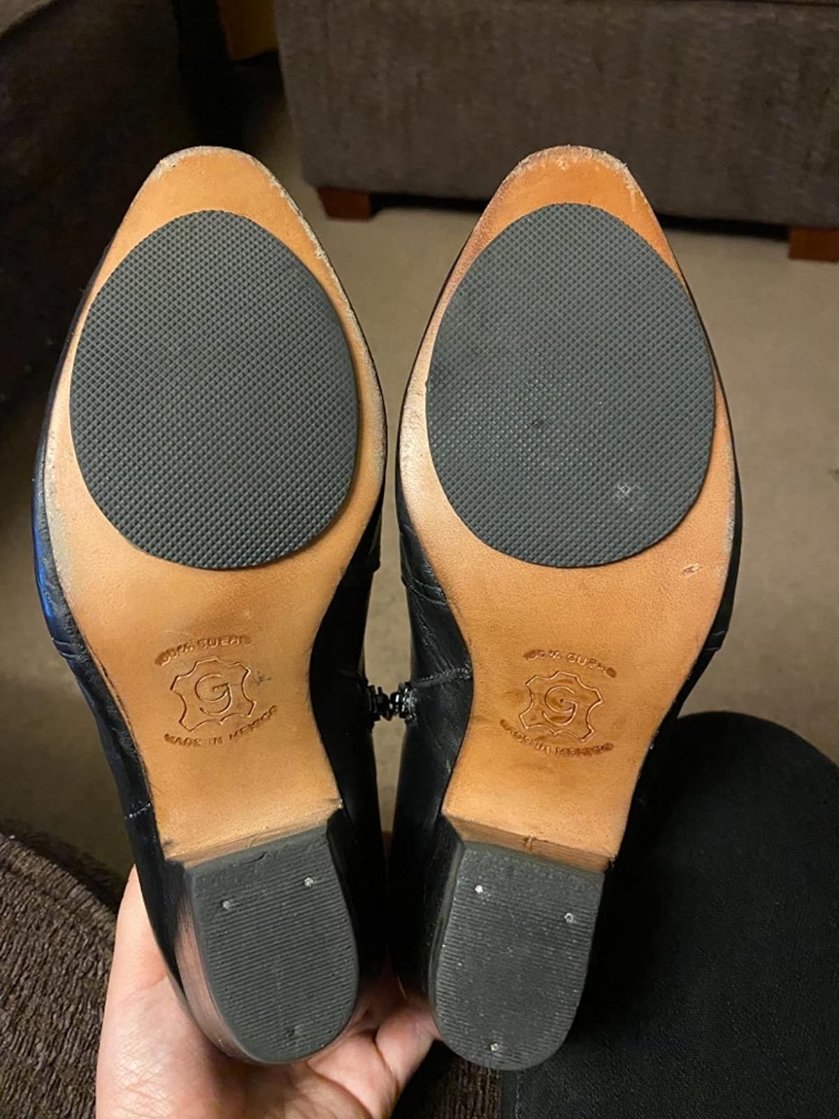 Reviewer showing pads on bottom of shoes
