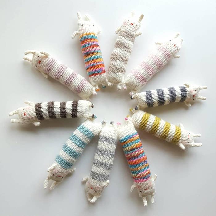 10 long knit minimalist rabbits with sweater patterns in different colors 