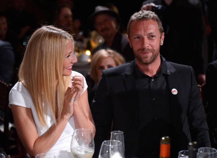 Gwyneth sits next to Chris at an event