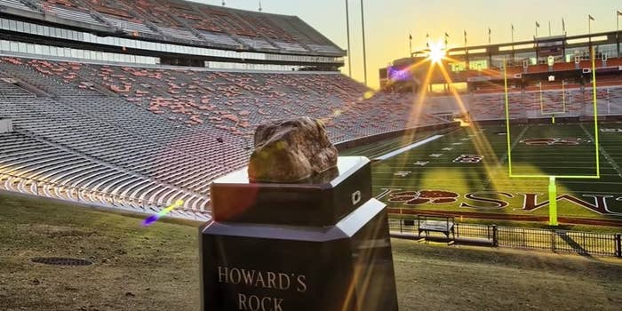 Howard's Rock sitting atop hill while the sun sets.