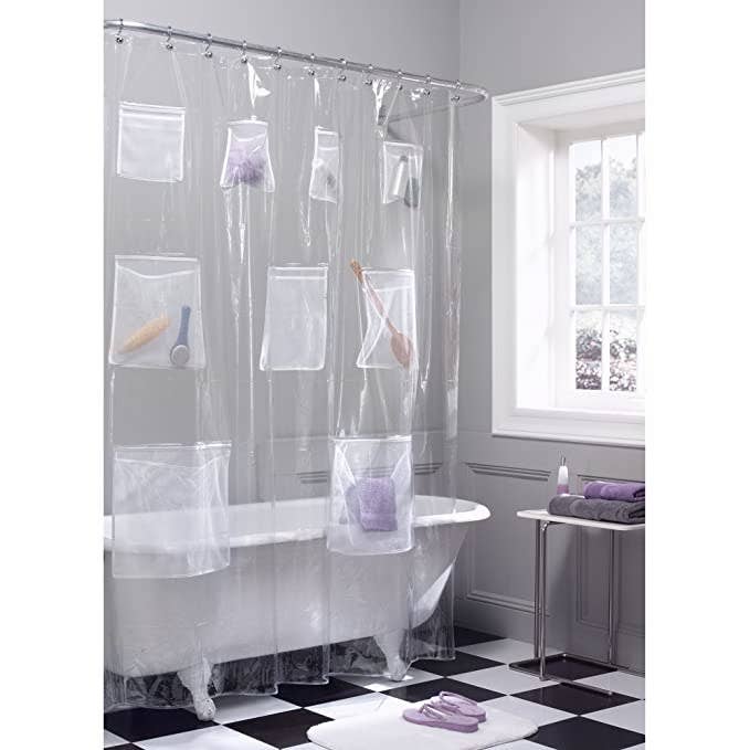 Clear shower curtain with pockets.