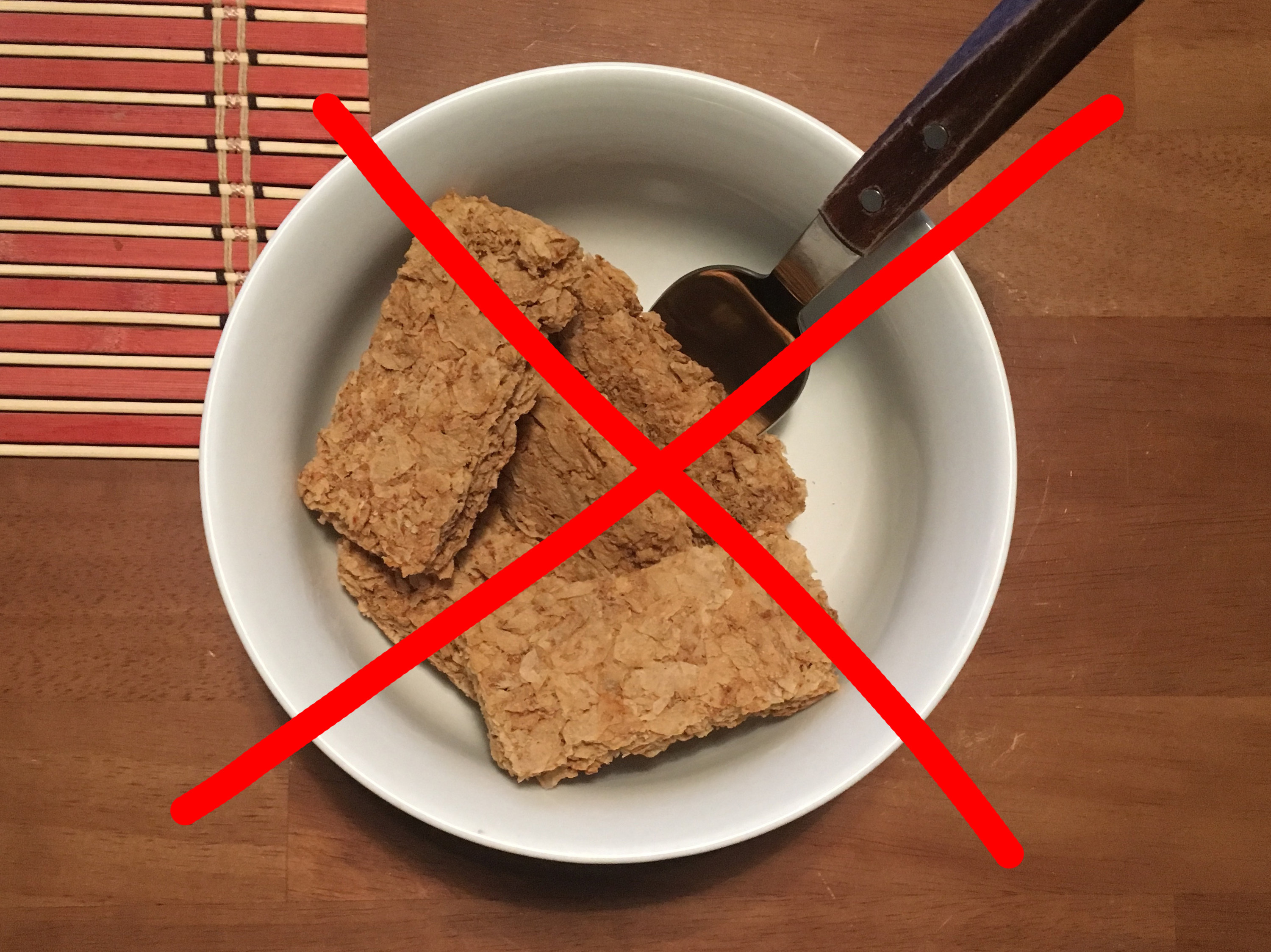 A bowl of Weet-Bix with a wrong red cross drawn over the top
