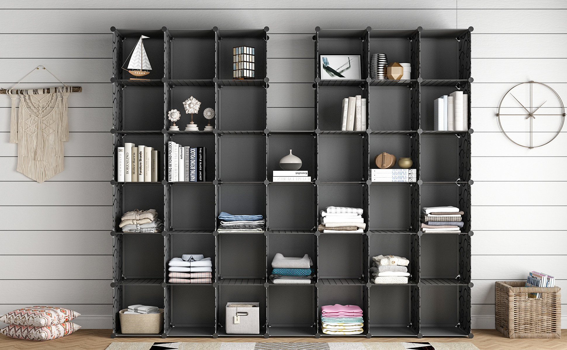 The large set of cubby shelves in gray, storing a mix of trinkets, books, and folded shirts