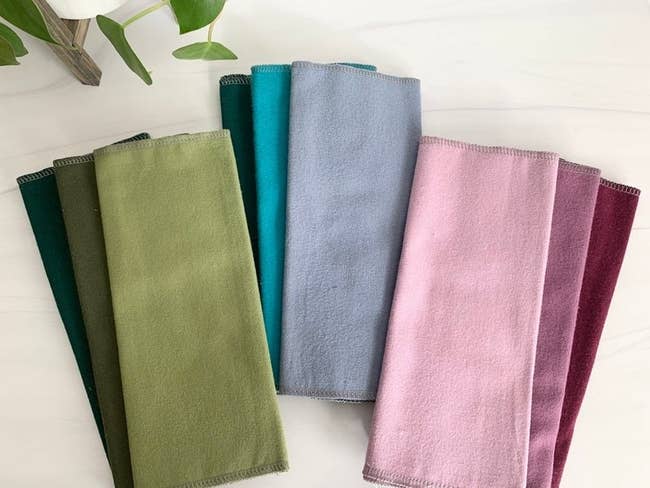 Various towels in different colors on a table