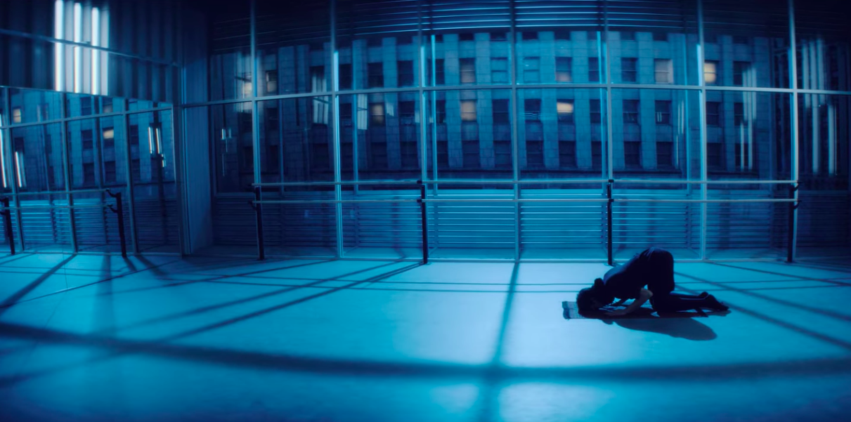 A Muslim man prays in a dance studio.