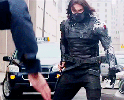 a man flips a knife at captain america