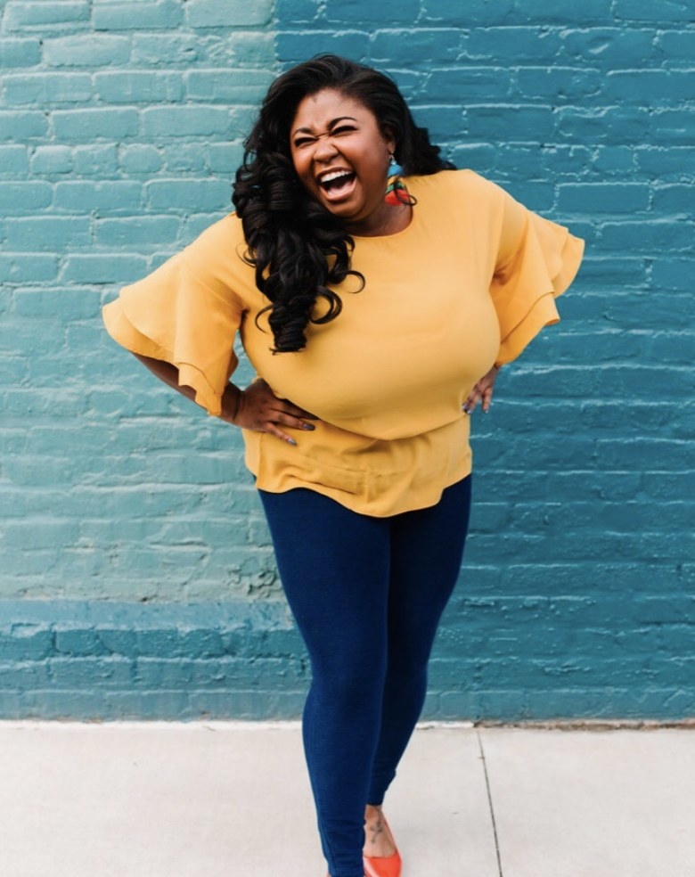 Reviewer photo of a person wearing denim jeans and a yellow blouse