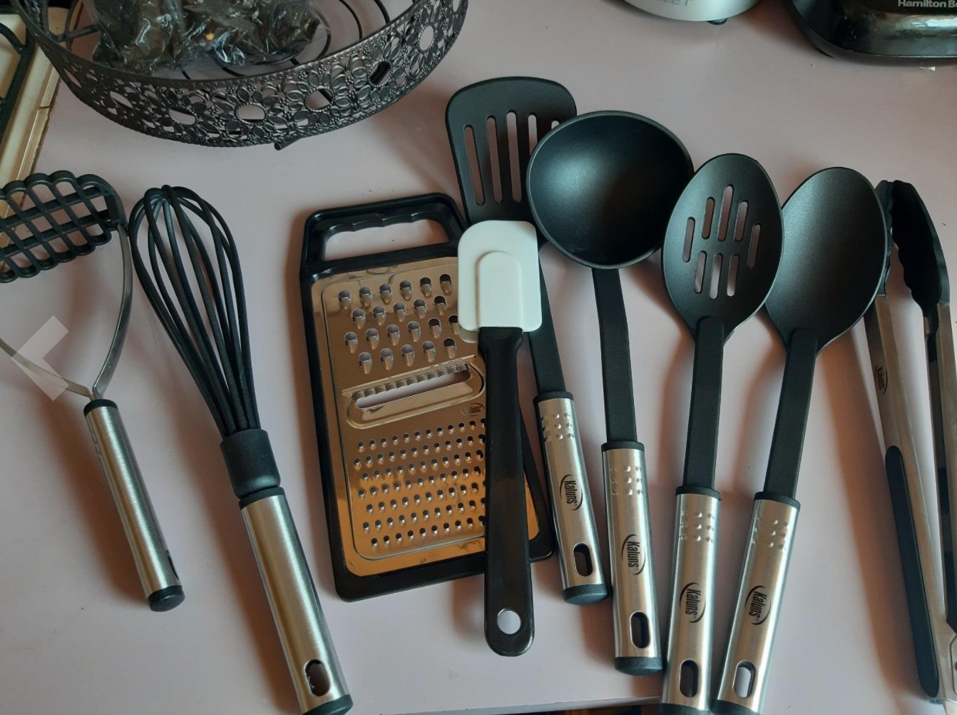 the set of 24 kitchen utensils on a reviewer&#x27;s countertop