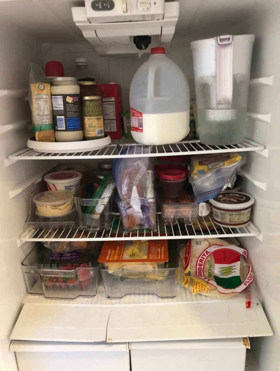 The reviewer&#x27;s photo of a set of fridge and freezer bins
