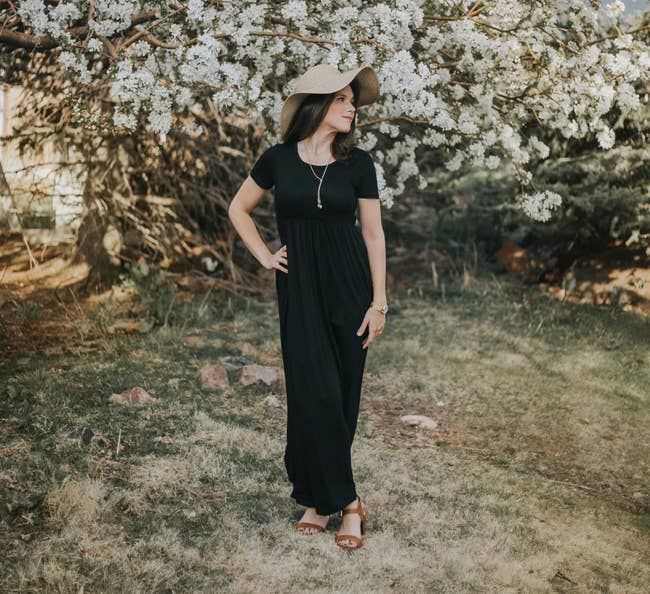 Reviewer wearing the black maxi dress