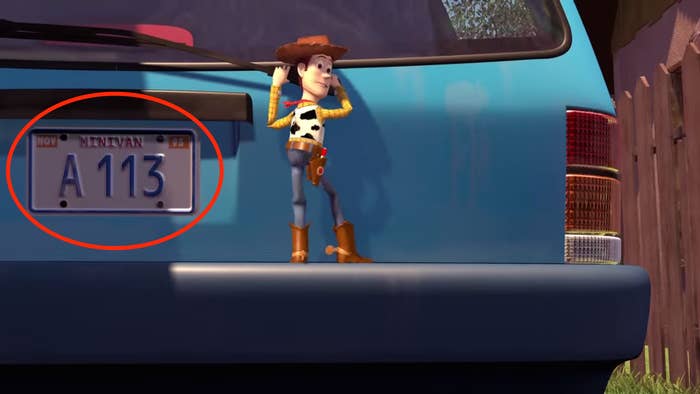 Woody holding on to the back of a car in Toy Story
