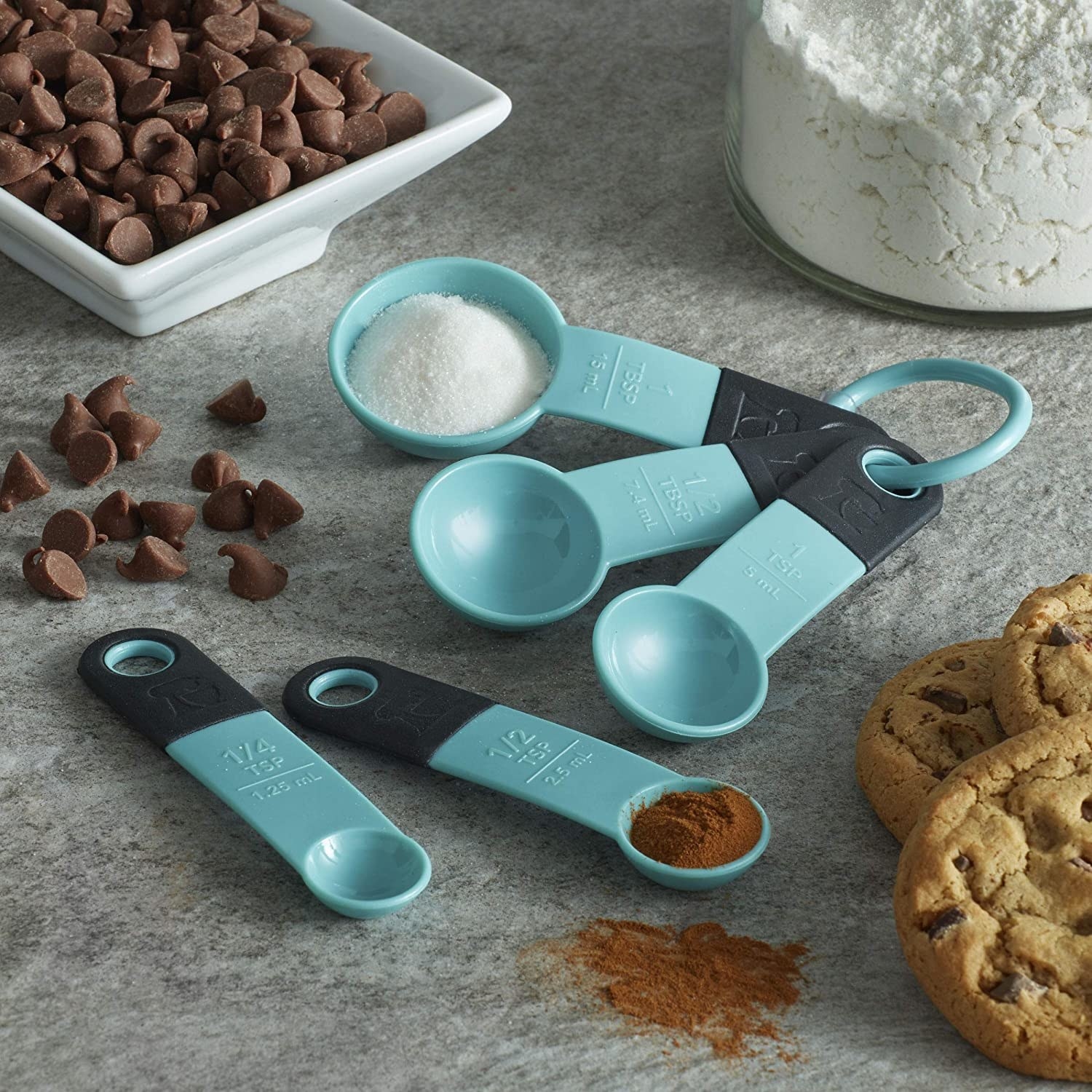 A set of plastic measuring spoons on a counter