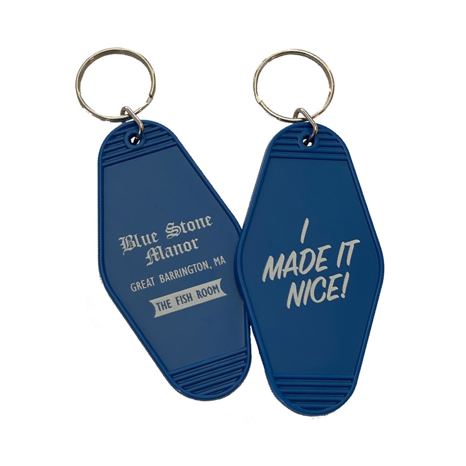 The blue motel-style keychain with text Blue Stone Manor Great Barrington MA on one side and I made it nice on the other