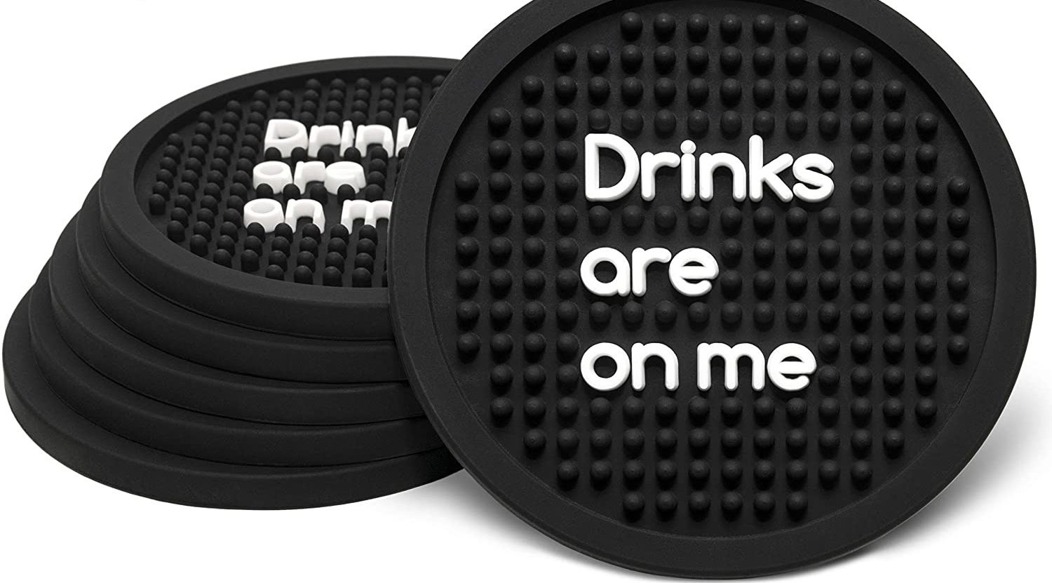 The textured coasters with white words &quot;Drinks are on me&quot;