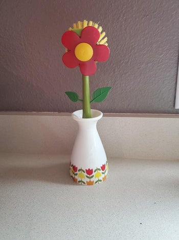Reviewer photo of flower-shaped dish brush
