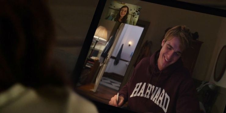 Elle FaceTiming Noah in his Harvard hoodie 