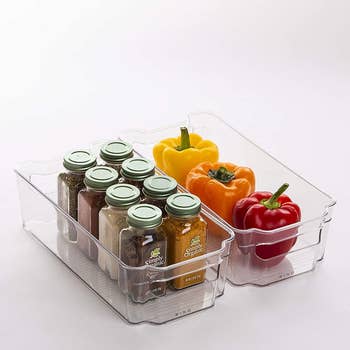spices and bell peppers in smaller clear bins