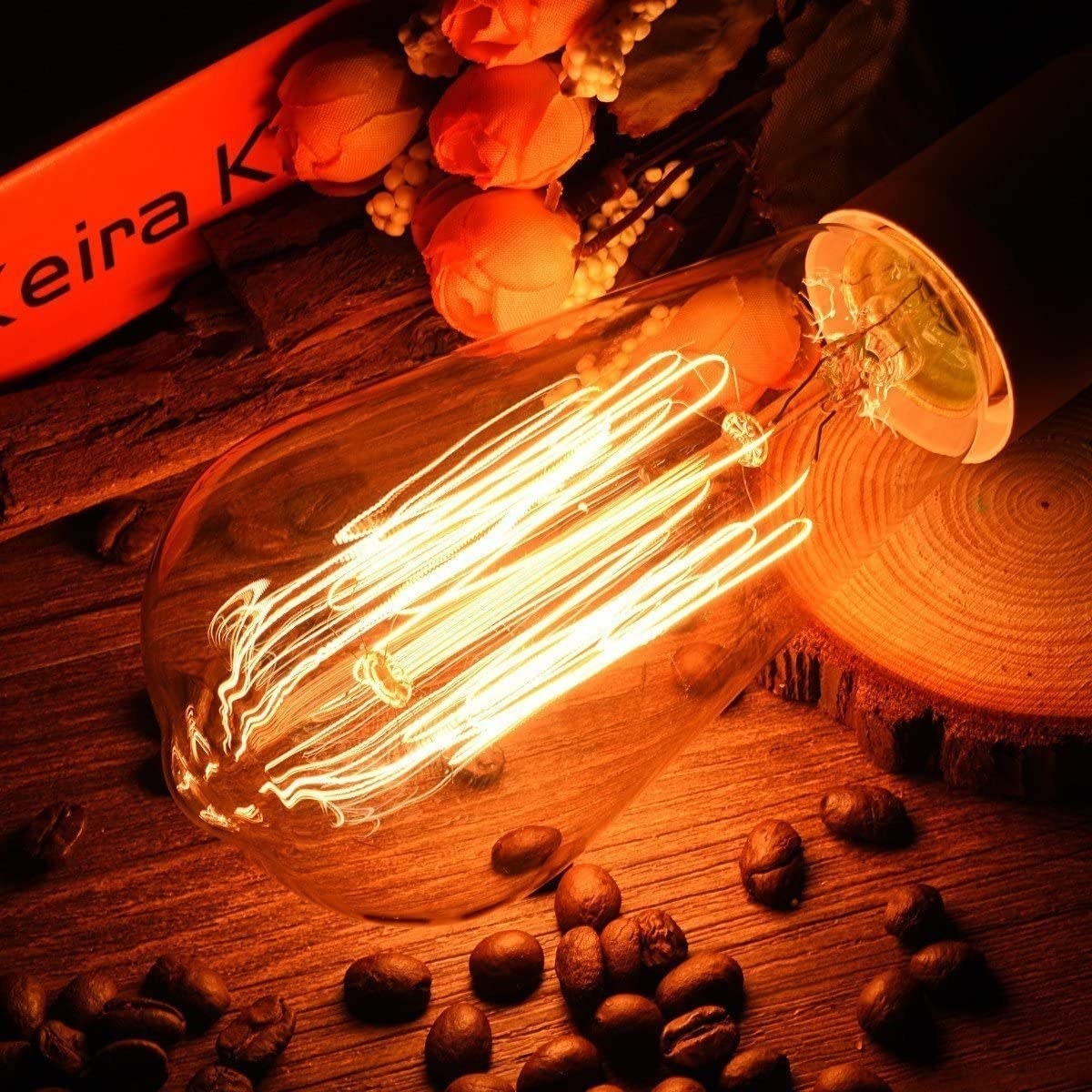the bulb on a table next to some coffee beans