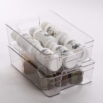 yogurt drinks and avocados in their respective clear bins, stacked