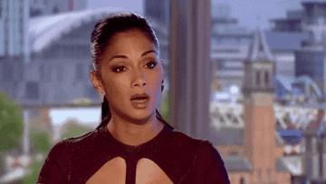 Nicole Scherzinger blinks slowly with a shocked, open mouth