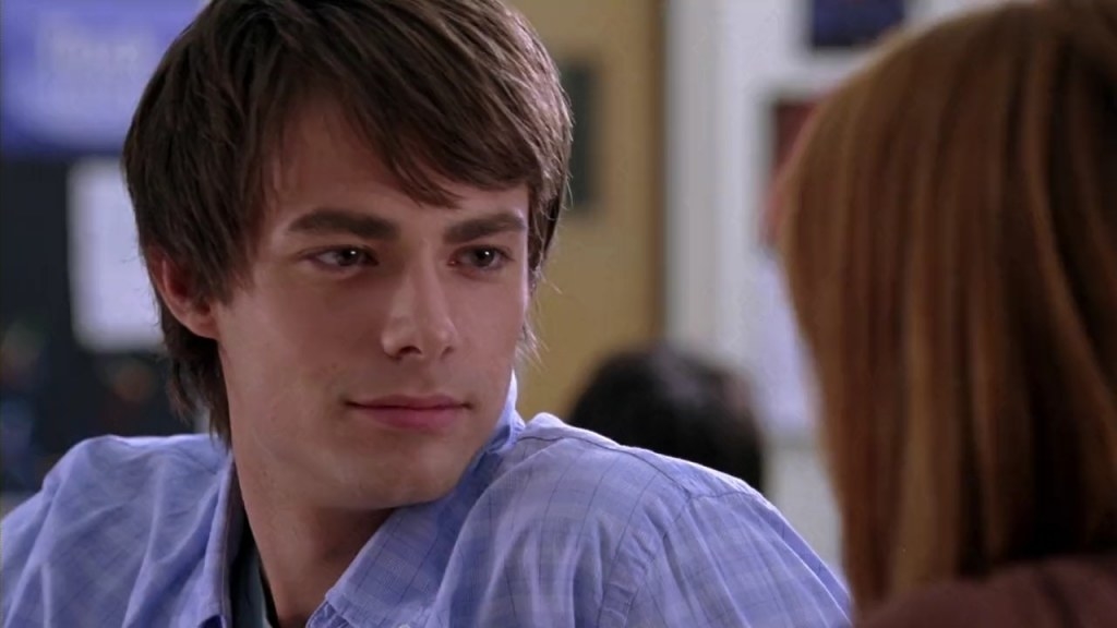 Aaron Samuels spinning in his chair to talk to Cady