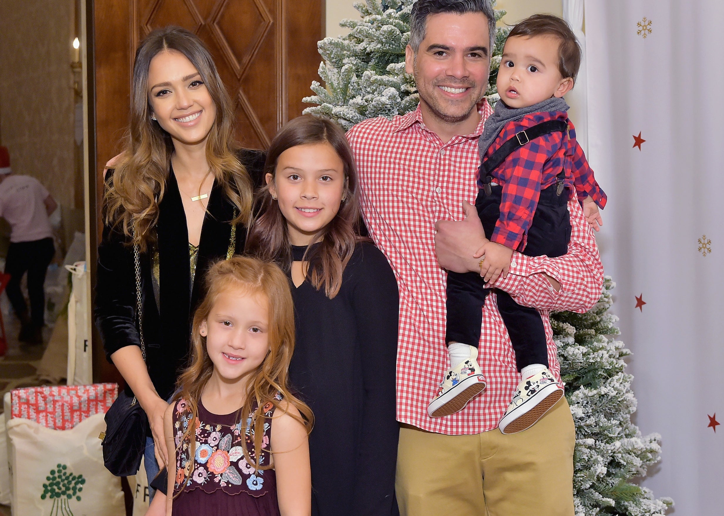 Jessica poses with her husband and three children