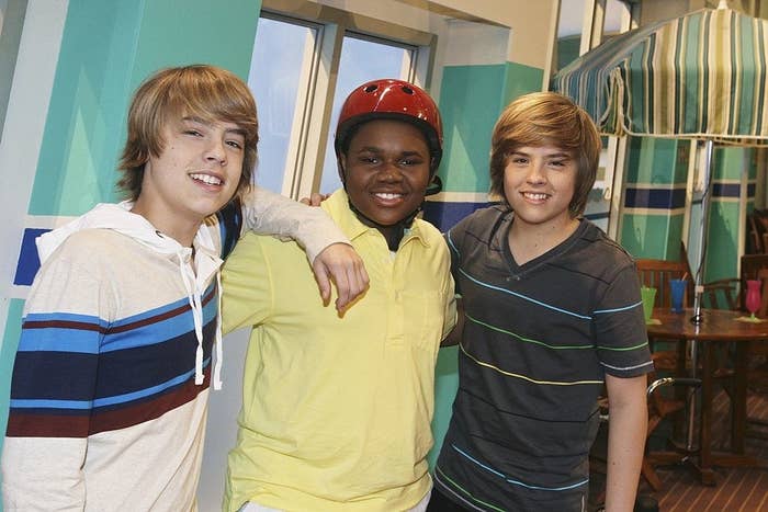 Cole Sprouse and Dylan Sprouse posing for a photo with fellow cast member Marcus Little