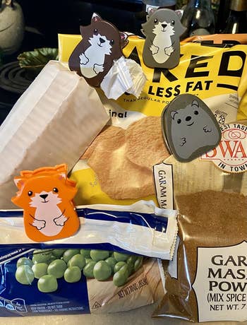 Various animal-shaped chip clips placed on bags