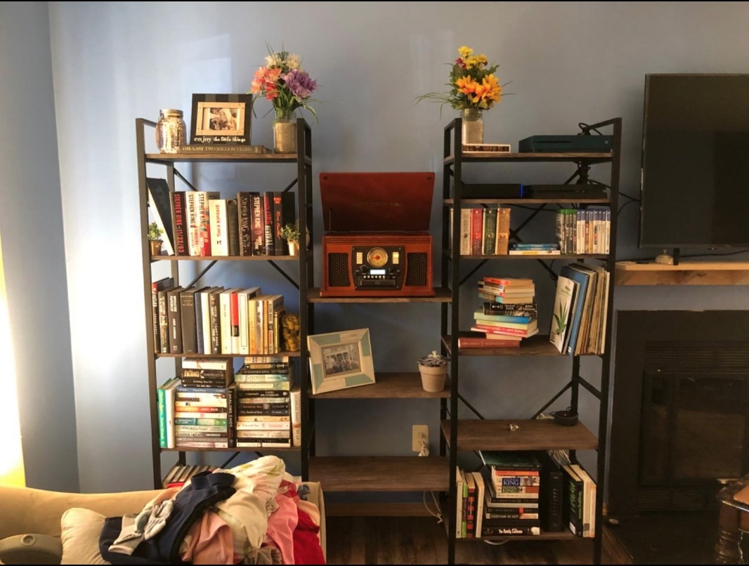 black and wood three-section bookcase in a reviewer&#x27;s home