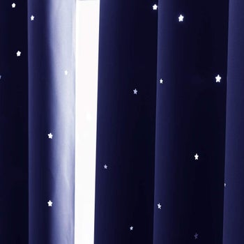 Closeup of curtains with star cutouts