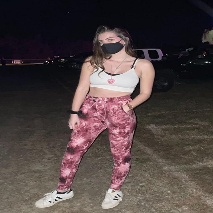 Reviewer wearing the jogger pants in pink tie dye