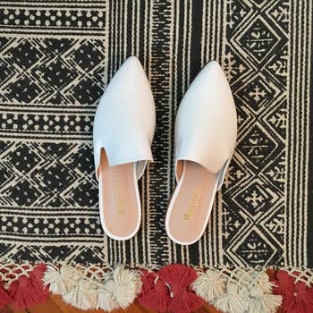reviewer's white backless flats