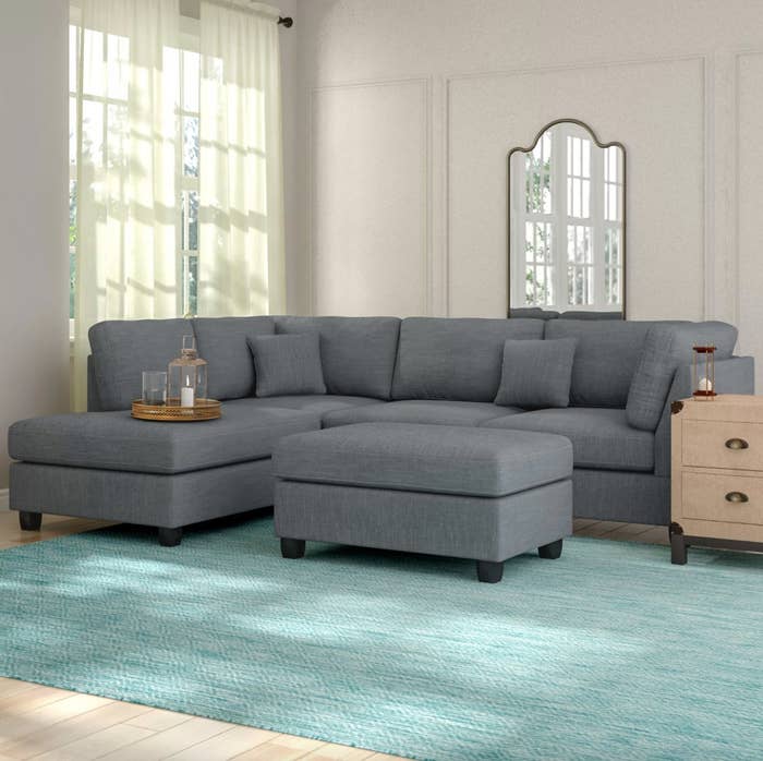 The reversible sectional with an ottoman in gray