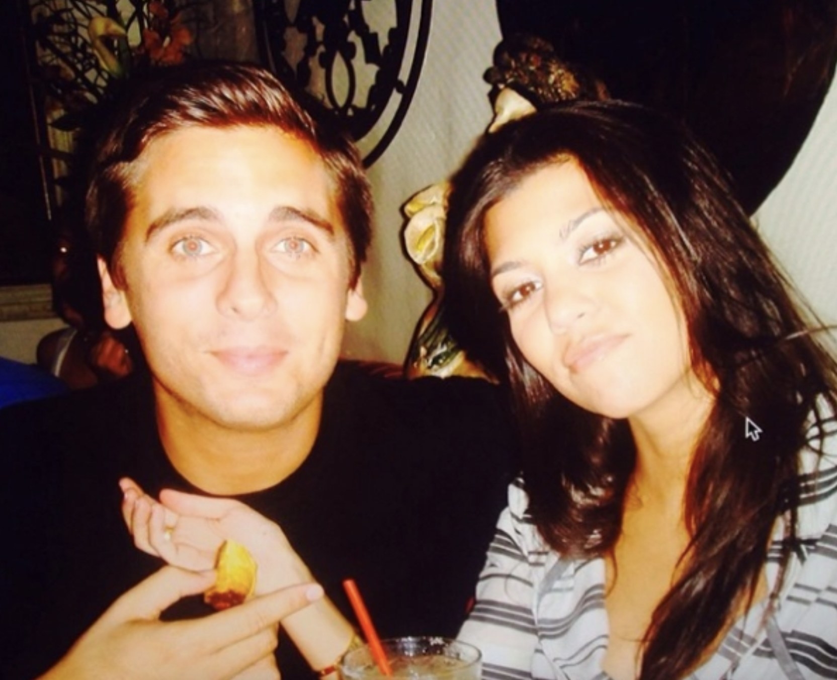 A very young Scott and Kourtney looking into the camera