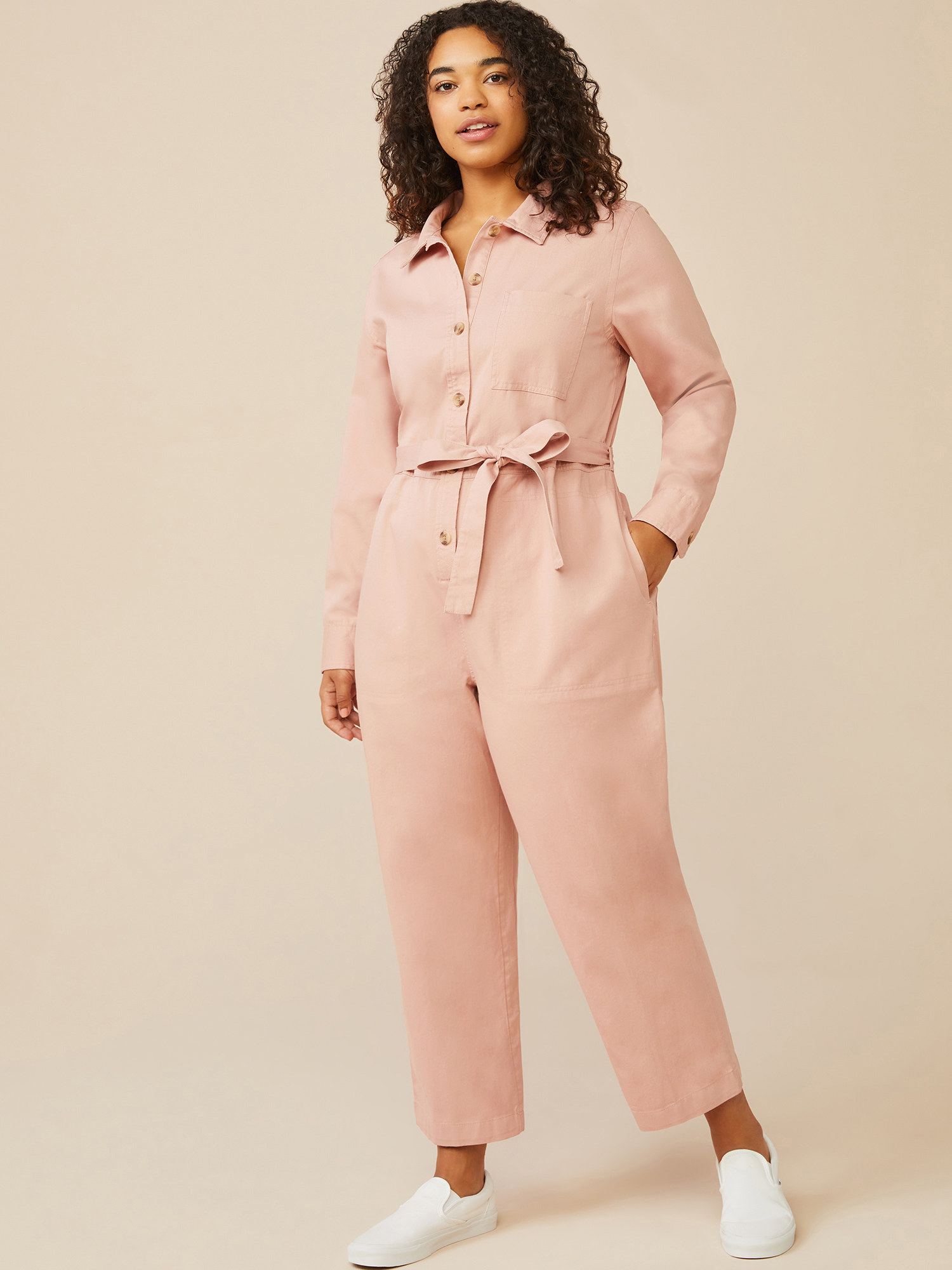model wearing the pastel pink coverall