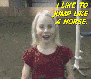 girl pretends to be a horse and jumps over course