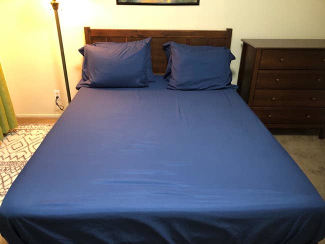 Reviewer photo of navy sheets on bed