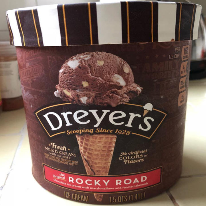 A pint of Dreyer's ice cream, rocky road, with brown packaging and specific font