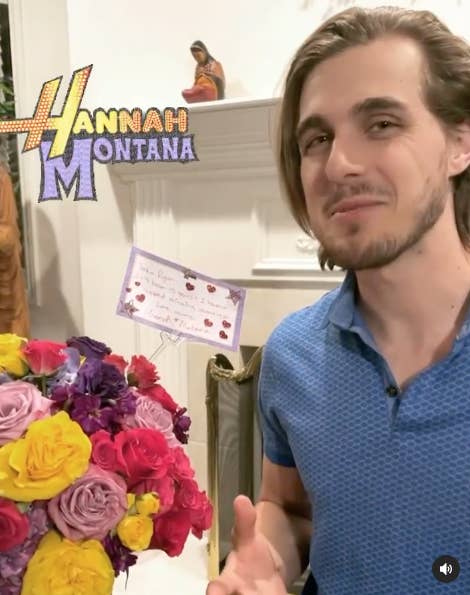 Cody Linley standing in front of a Hannah Montana bouquet 