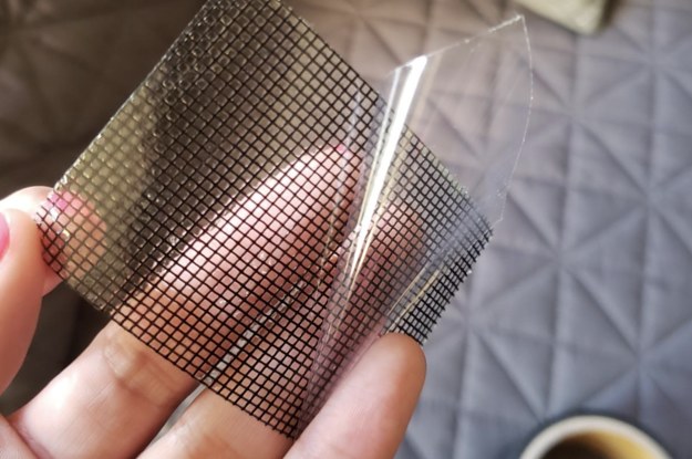 A customer review photo of them holding up a piece of the mesh repair tape